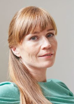 portrait-of-red-haired-mid-adult-woman-looking-at-2022-03-04-01-55-05-utc.jpg